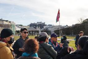 Tourists Sightseeing In Salzburg