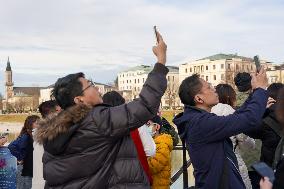 Tourists Sightseeing In Salzburg