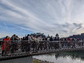 Tourists Sightseeing In Salzburg