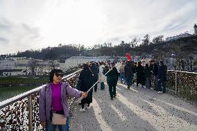 Tourists Sightseeing In Salzburg