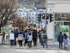 Tourists Sightseeing In Salzburg