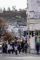 Tourists Sightseeing In Salzburg