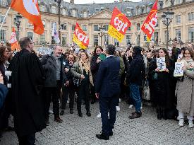 Gerald Darmanin talks to court clerks protesting at Place Vendome - Paris