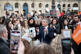 Gerald Darmanin talks to court clerks protesting at Place Vendome - Paris