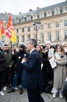 Gerald Darmanin talks to court clerks protesting at Place Vendome - Paris