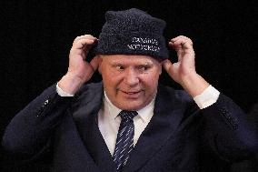 Doug Ford Hands Out 'Canada Is Not for Sale' Toques At A Press Conf.