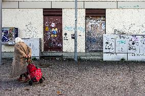 An Elderly Woman With Shopping Trolley