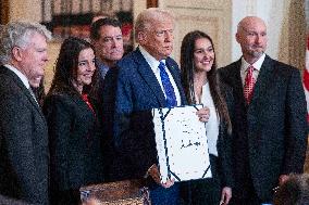 US President Donald Trump signs the Laken Riley Act