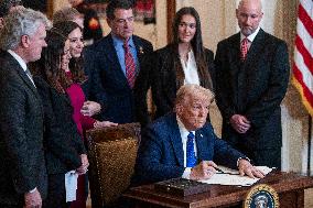 US President Donald Trump signs the Laken Riley Act