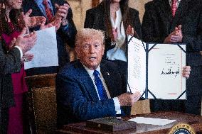 US President Donald Trump signs the Laken Riley Act