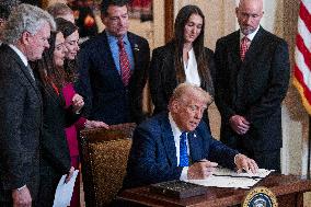 US President Donald Trump signs the Laken Riley Act