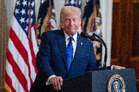 US President Donald Trump signs the Laken Riley Act