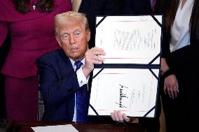 Donald Trump signs the Laken Riley Act - Washington
