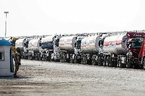 Aid Trucks Wait to Enter Gaza