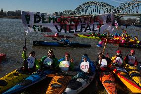Protesters Paddle For Diversity In Cologne