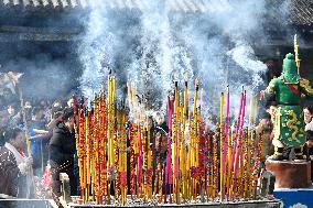 Burning Incense and Praying For Blessings
