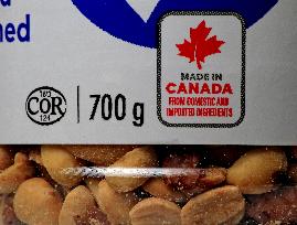 Consumer Grocery Products With Various Labels Showing Country Of Origin.