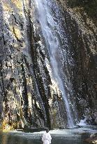 Frozen waterfall plunge pool in western Japan