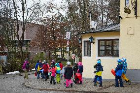 Teachers Leading Children Safely Through The Streets