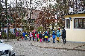 Teachers Leading Children Safely Through The Streets