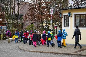 Teachers Leading Children Safely Through The Streets