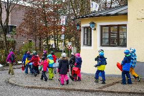 Teachers Leading Children Safely Through The Streets