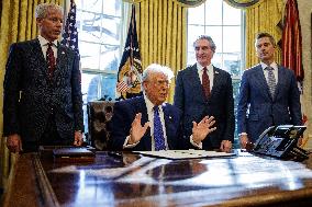 DC: U.S. President Trump Signs Executive Orders in the Oval Office