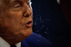 DC: U.S. President Trump Signs Executive Orders in the Oval Office