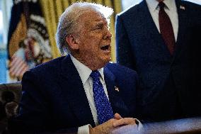 DC: U.S. President Trump Signs Executive Orders in the Oval Office