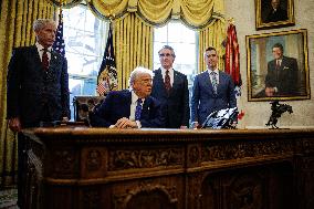 DC: U.S. President Trump Signs Executive Orders in the Oval Office