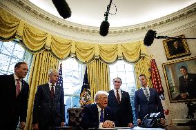 DC: U.S. President Trump Signs Executive Orders in the Oval Office