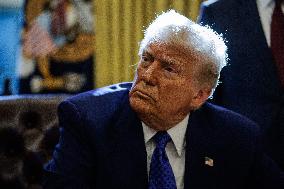 DC: U.S. President Trump Signs Executive Orders in the Oval Office