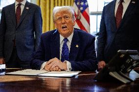 DC: U.S. President Trump Signs Executive Orders in the Oval Office