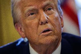 DC: U.S. President Trump Signs Executive Orders in the Oval Office