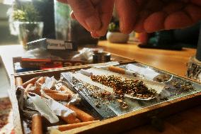 Cannabis User Rolls A Joint