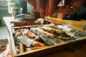 Cannabis User Rolls A Joint