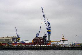 Freight Cranes In The Harbor Of Hamburg