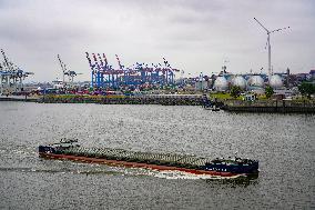 Freight Cranes In The Harbor Of Hamburg