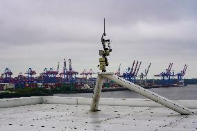 Freight Cranes In The Harbor Of Hamburg