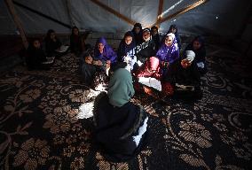 Displaced Palestinian Girls Study the Koran in Tent Shelter Amid Gaza Ceasefire