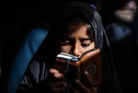 Displaced Palestinian Girls Study the Koran in Tent Shelter Amid Gaza Ceasefire