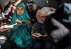 Displaced Palestinian Girls Study the Koran in Tent Shelter Amid Gaza Ceasefire