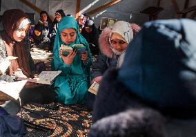 Displaced Palestinian Girls Study the Koran in Tent Shelter Amid Gaza Ceasefire