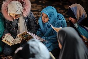 Displaced Palestinian Girls Study the Koran in Tent Shelter Amid Gaza Ceasefire