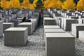 Tourists Visit The Holocaust Memorial Berlin