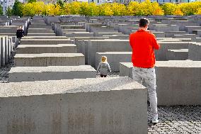 Tourists Visit The Holocaust Memorial Berlin