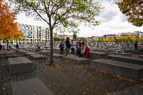 Tourists Visit The Holocaust Memorial Berlin