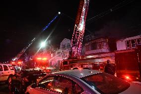 Firefighters Struggle To Put Out Fire In Three Homes On Woodside Avenue In Newark New Jersey Due To High Winds And Freezing Temp