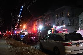 Firefighters Struggle To Put Out Fire In Three Homes On Woodside Avenue In Newark New Jersey Due To High Winds And Freezing Temp