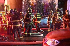 Firefighters Struggle To Put Out Fire In Three Homes On Woodside Avenue In Newark New Jersey Due To High Winds And Freezing Temp